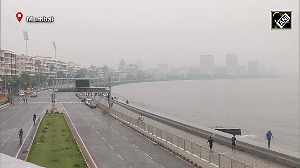 Mumbai experiences light showers and fog