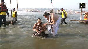 Maha Kumbh Uttarakhand CM Pushkar Singh Dhami takes holy dip at Triveni Sangam with his family