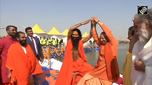 Yoga guru Ramdev teaches CM Yogi 'yoga poses' at Prayagraj Maha Kumbh