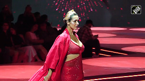 Malaika Stuns in Fiery Red Cutout Dress, Rules the Ramp Again