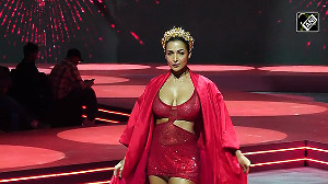 Malaika Stuns in Fiery Red Cutout Dress, Rules the Ramp Again