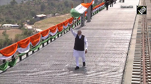 PM Modi waves Tiranga as he inaugurates Chenab bridge