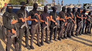 Gaza braces for arrival of freed prisoners, with armed Hamas members on alert