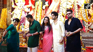 Kajol Ajay Devgn perform Durga Puja at Sarbojanin Pandal launch new production house kids join in