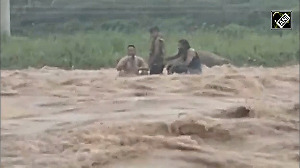 Indian Army SDRF rescue minor boy trapped in flooded river in J&K s Rajouri