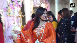 Neha Sharma glamorous style seen in a suit posed with a cute smile