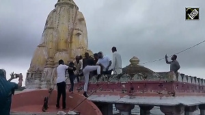 Devotees Climb Submerged Temple for Aarti in Banswara