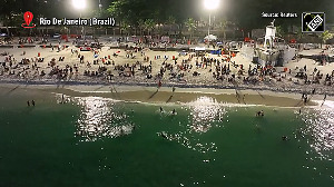 It's so hot, Rio beaches are packed at night